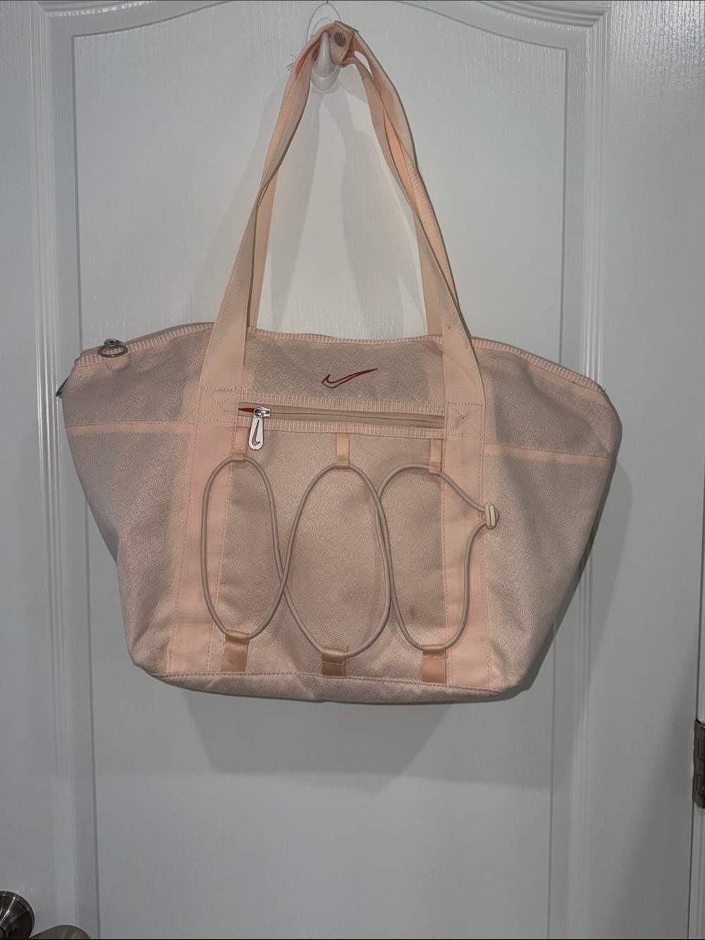 Nike One Women's Training Tote Bag with bungee cords on the exterior light pink